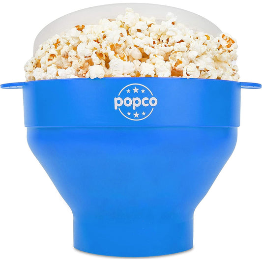 A blue silicone microwave popcorn popper filled with fresh cooked popcorn.