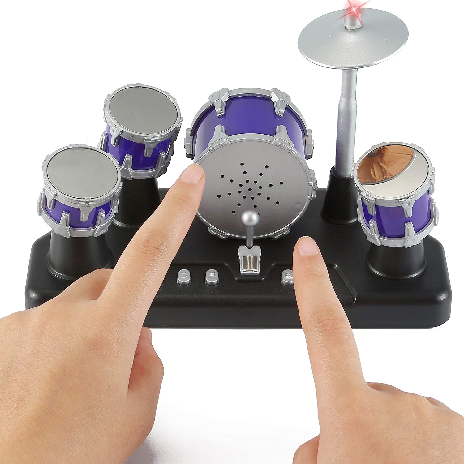A person is using two fingers to play on a mini finger desktop drum set.