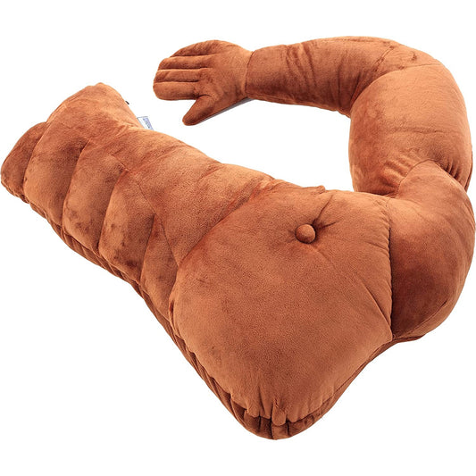 A brown colored muscle man pillow which looks like half of a muscled mans torso.