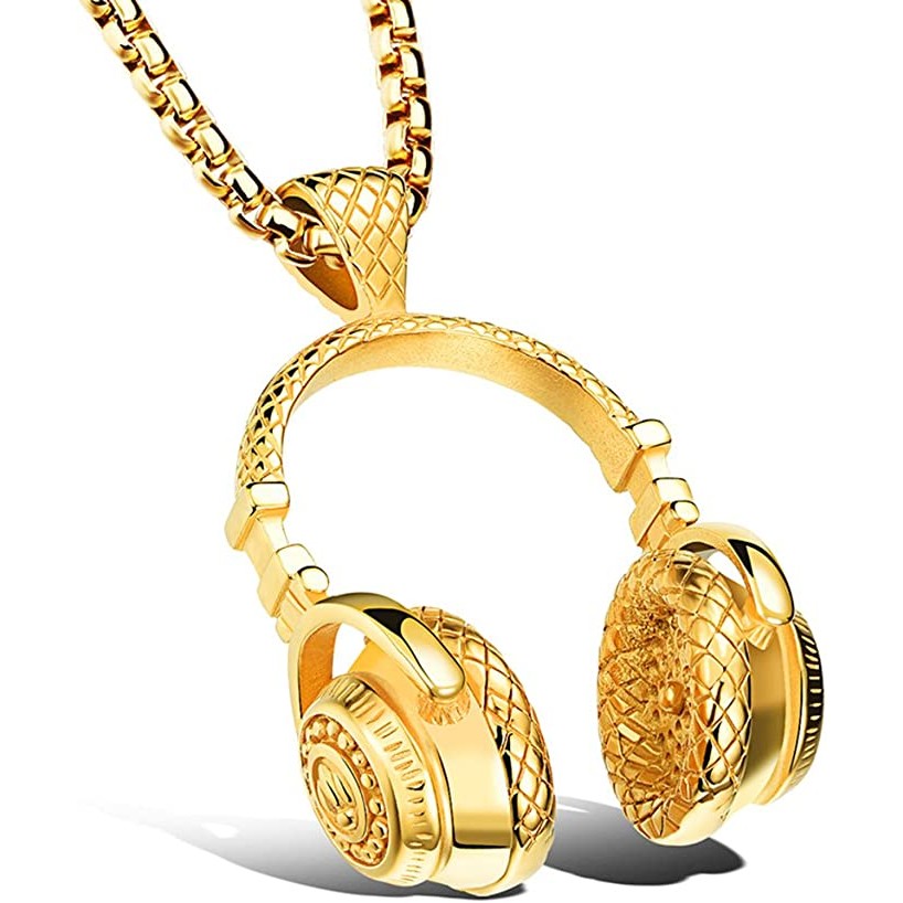 A gold necklace and pendant which has a pair of musical headphones as the pendant.
