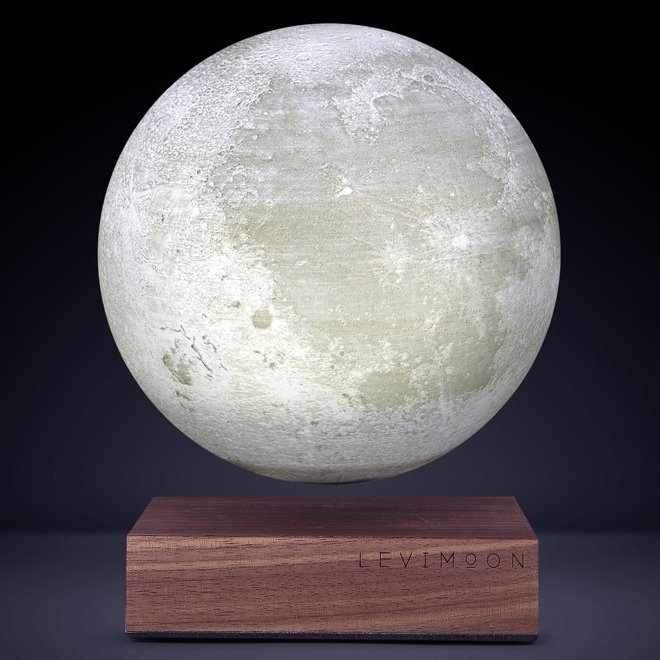 Levitating moon lamp floating above a wooden base