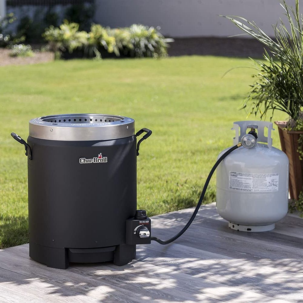 An oil-less liquid propane turkey fryer outdoors connected to propane ready to use.