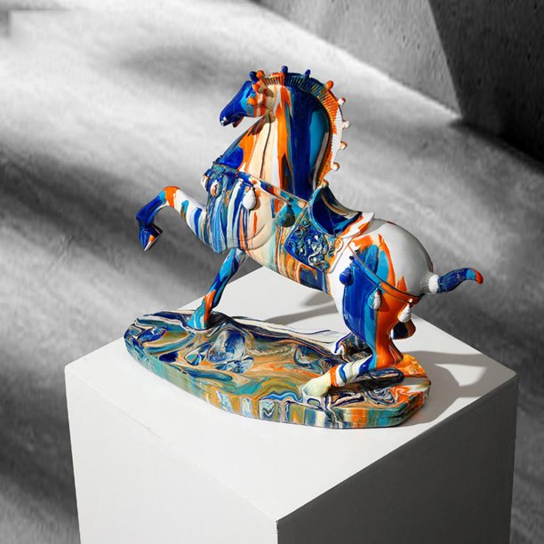 Horse figurine covered in drips of colorful paint on a white plinth.