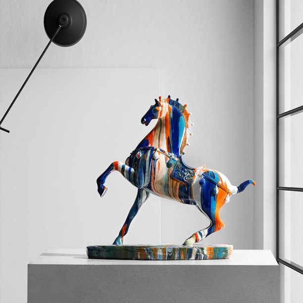 A galloping horse figurine covered in drips of colorful paint propped up on a white plinth.
