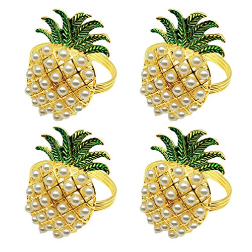 Four pineapple shaped napkin ring holders on a white background