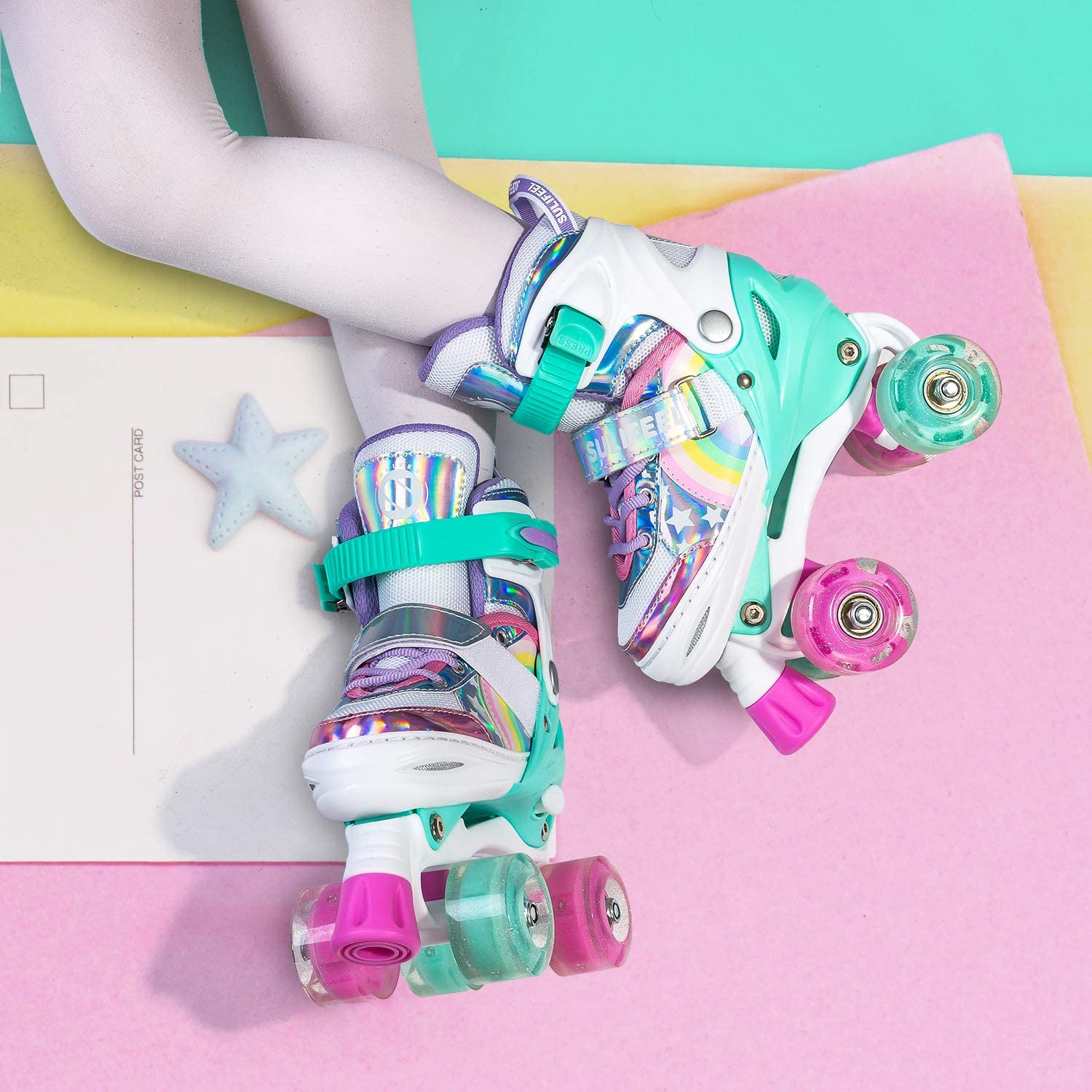 A pair of kids rainbow unicorn roller skates on a child's feet.