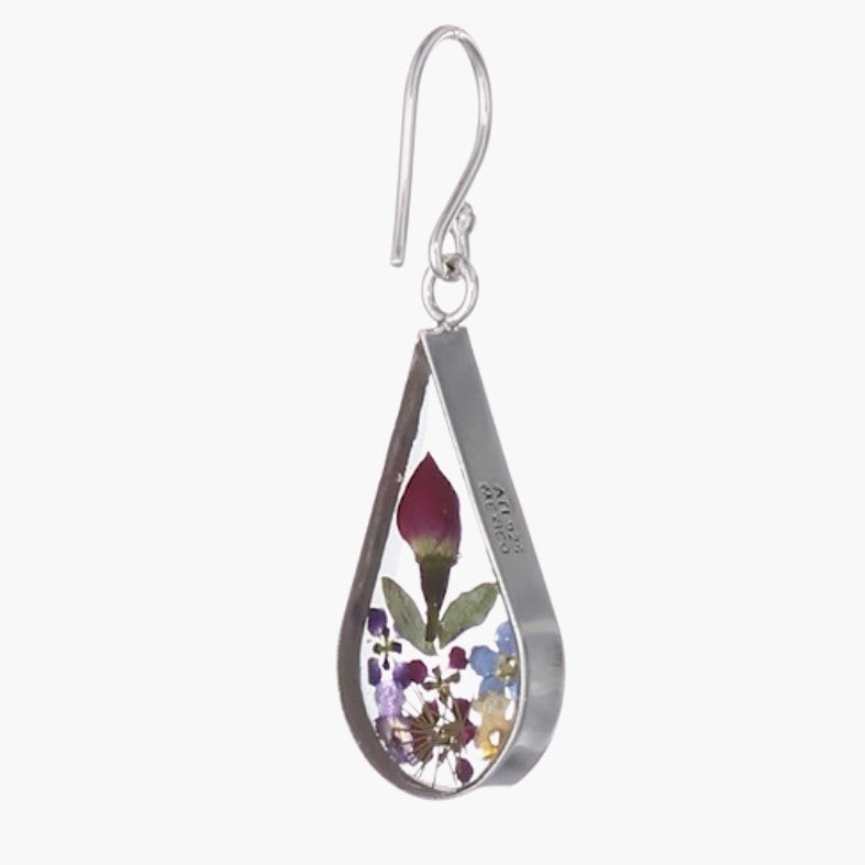 A single earring with real pressed flowers inside.