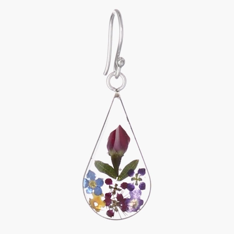 A single earrings with real pressed flowers inside resin.