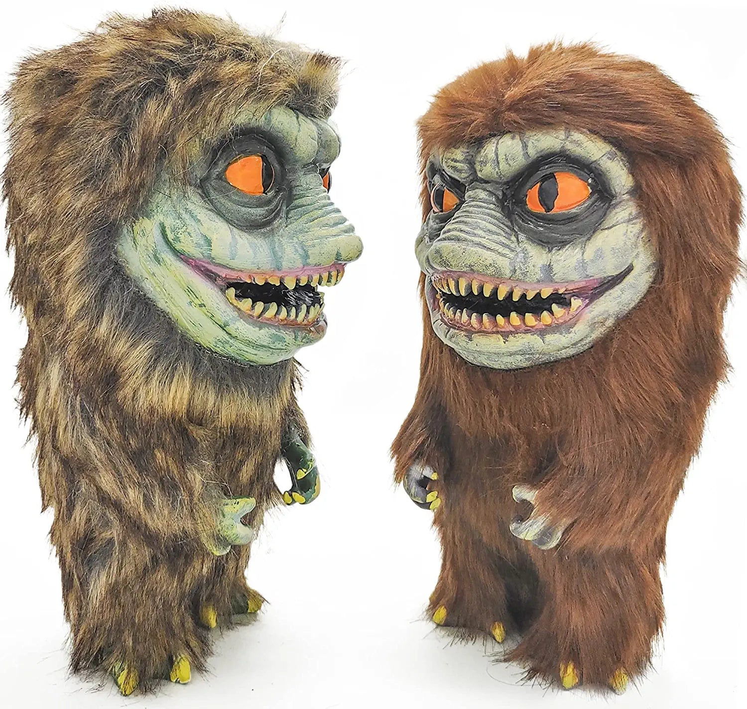 Two critter dolls from the Critters movies facing each other with orange colored eyes.