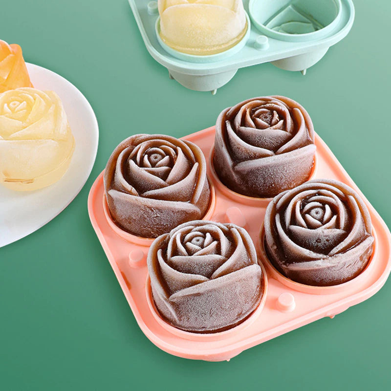 A rose shaped ice cube mold which has 4 cola colored rose shaped ice cubes ready-made in the mold.