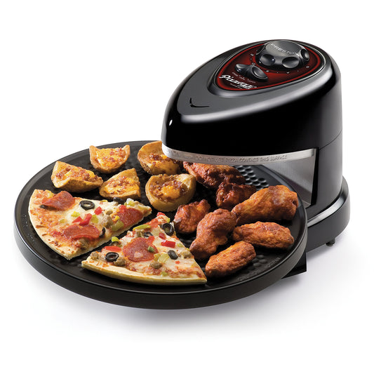 A Presto rotating pizza oven with 2 slices of pizza, chicken wings and potato wedges sitting on the tray