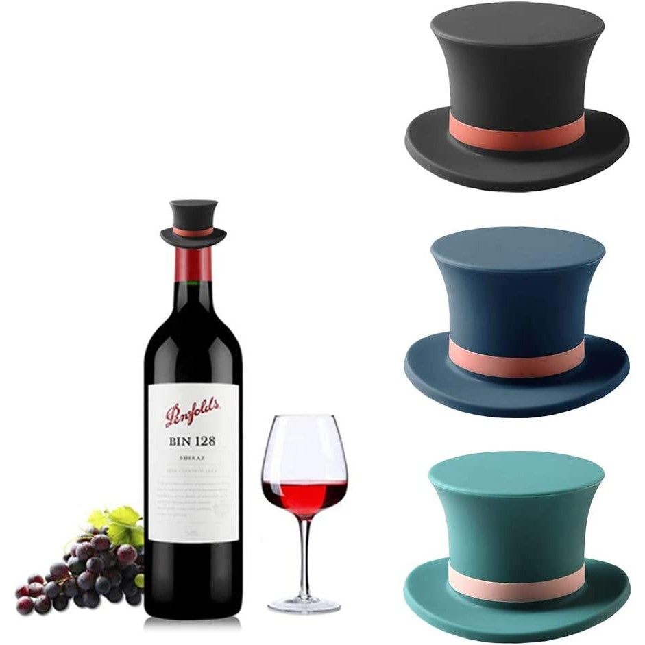 Three silicone wine stoppers shaped as old fashioned top hats along with a bottle of Penfolds BIN128 red wine.