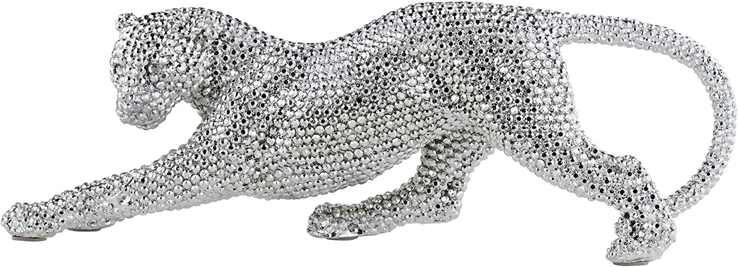 A side view of a silver decorative prowling leopard which looks like its simmering with rhinestones.