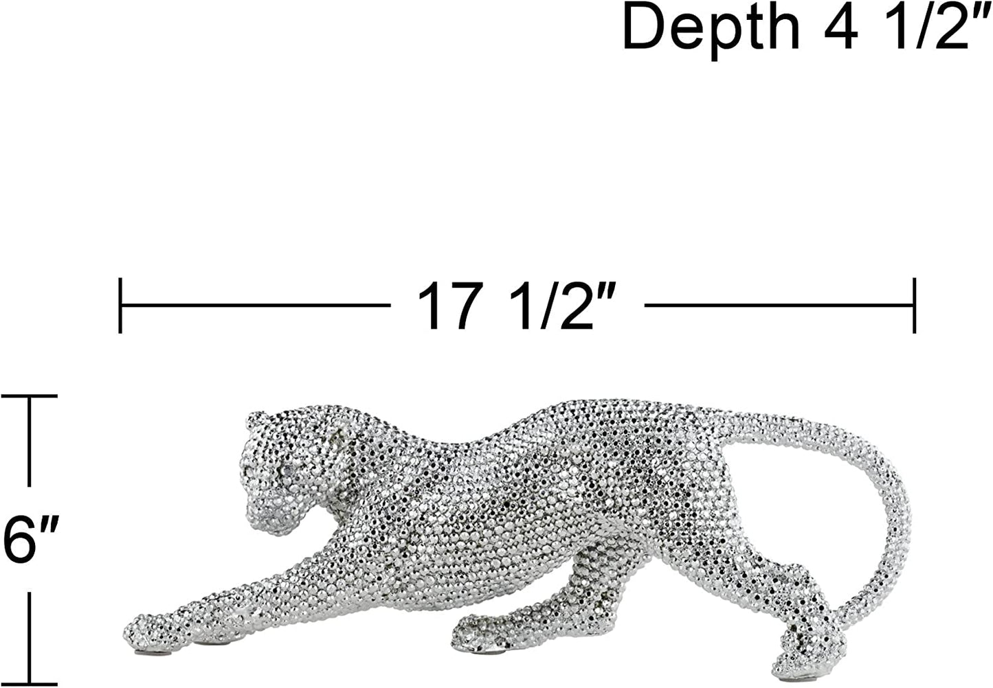 Size measurements of a silver sculpture of a prowling leopard. It measures 17.5 inches across and 6 inches in height
