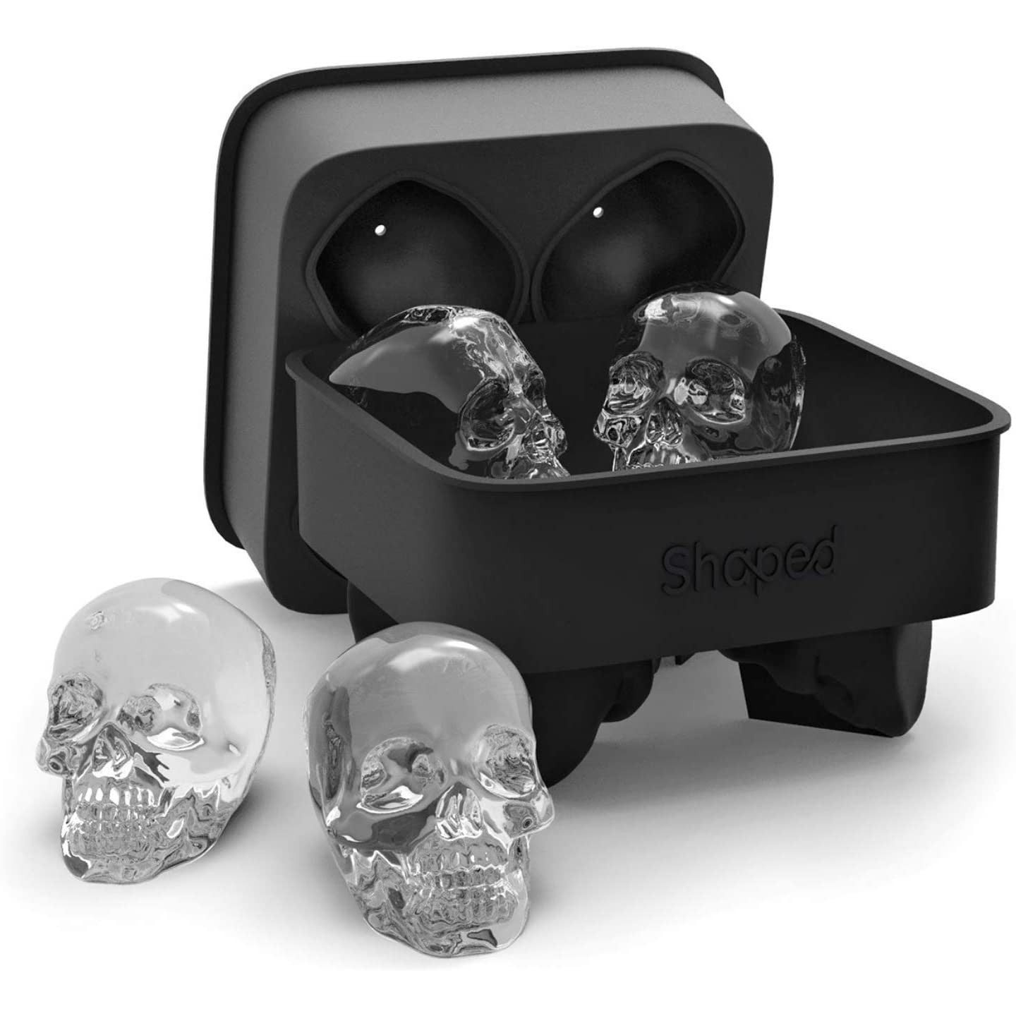A black silicone ice cube mold which allows you to make 4 large skull shaped ice cubes for your drinks. There are 4 ready-made skull shaped ice cubes as examples.