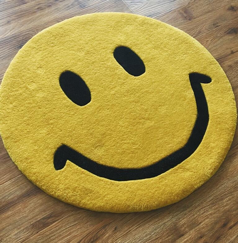A cheery yellow rug which looks like a smiley face emoji.