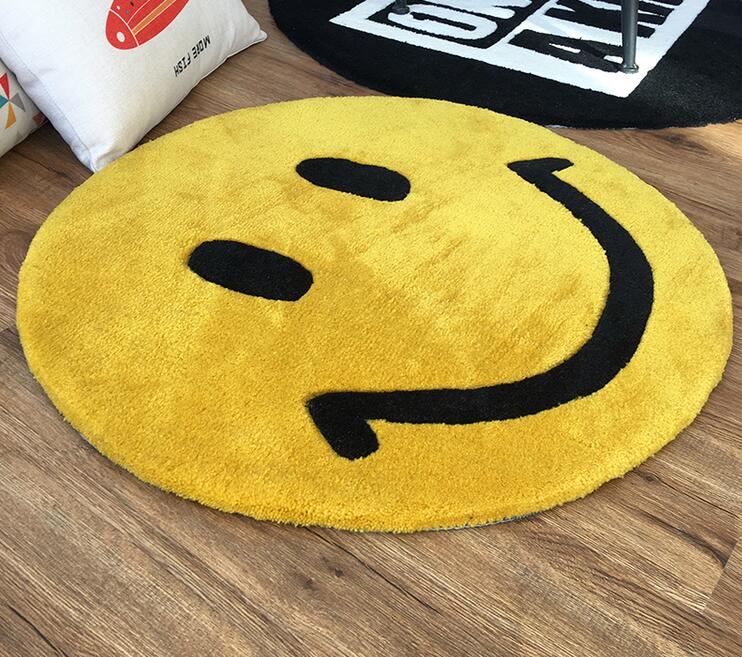 A yellow rug which looks like a smiley face emoji.