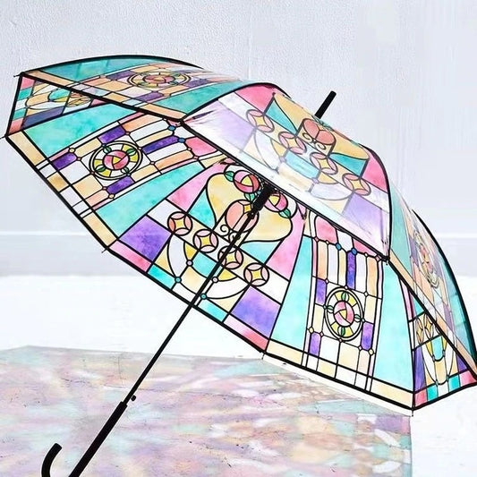 An umbrella which looks like it is made out of stained glass with a colour pattern.