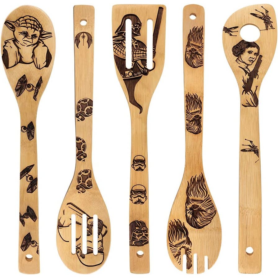 Five wooden bamboo kitchen utensil with Star Wars characters and Star Wars fighter planes burnt into the wood.