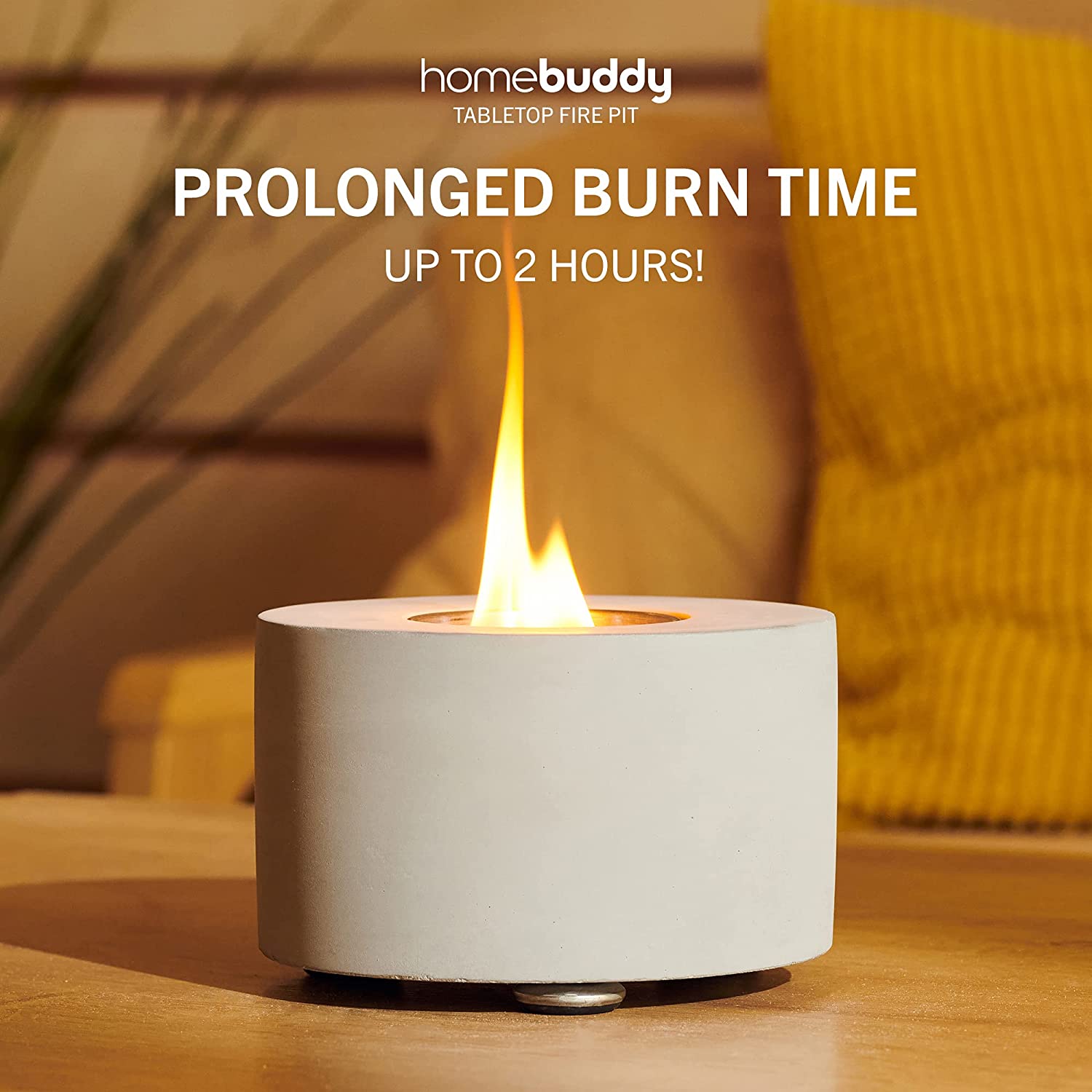 A stylish white mini table top fireplace which is lit up with a flame in the centre. There is text which reads, 'prolonged burn time up to 2 hours.'