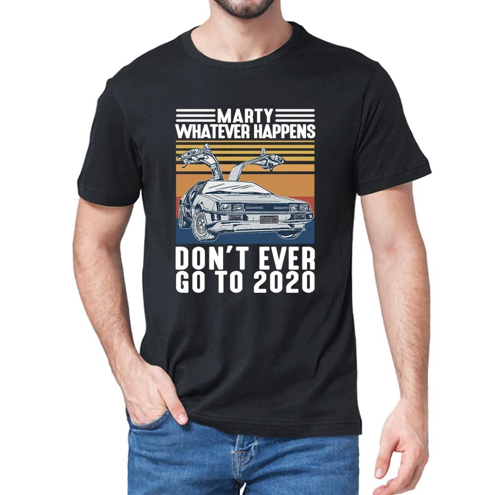 A male wearing a black Back To The Future t-shirt which says, Marty Whatever Happens Don't Ever Go To 2020