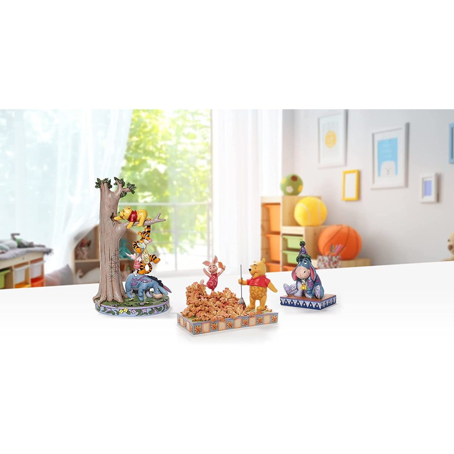 A set of Winnie the Pooh figurines.