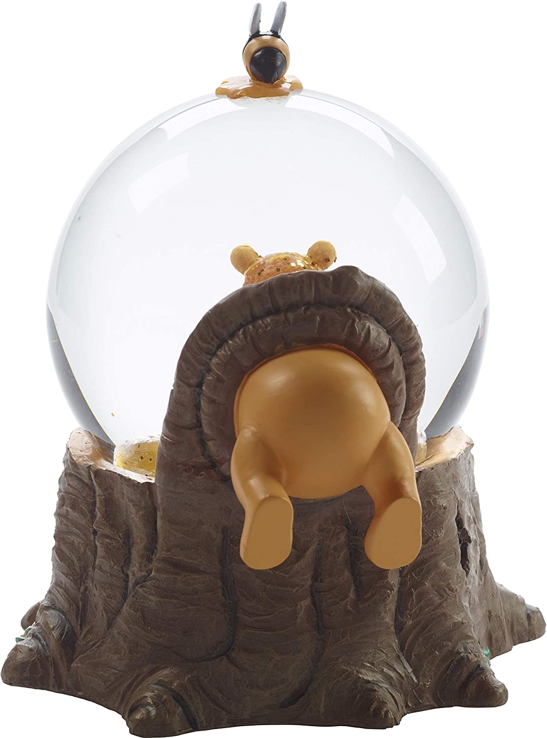 A back view of a Winnie The Pooh snow globe. It shows Winnie's lower half of his body hanging out of the globe itself.